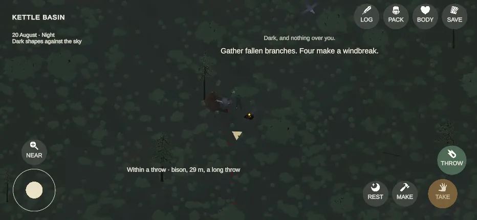Night: the survivor beside the carcass and a small fire, the kill still whole